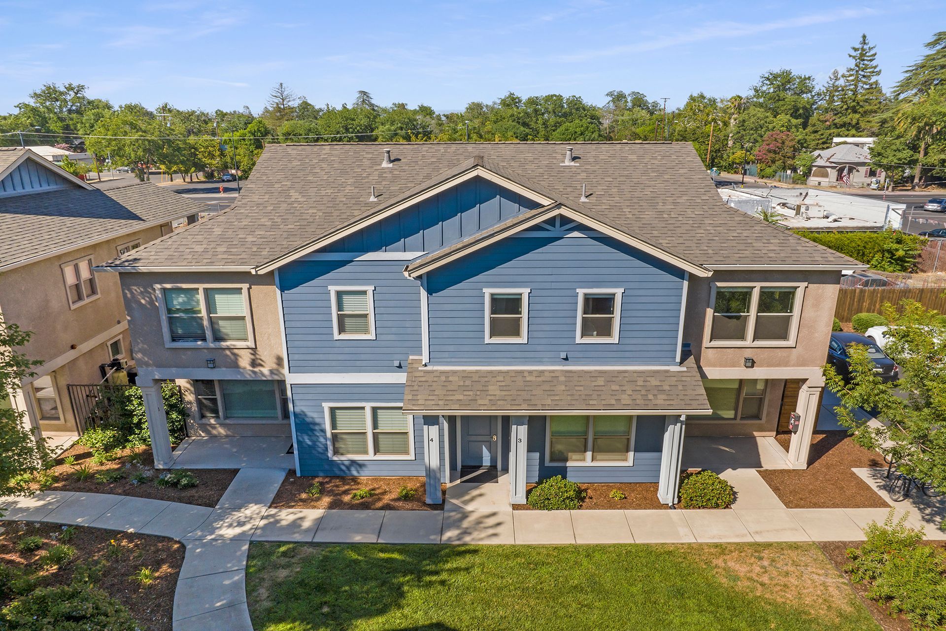 Uptown Place blue duplex building exterior